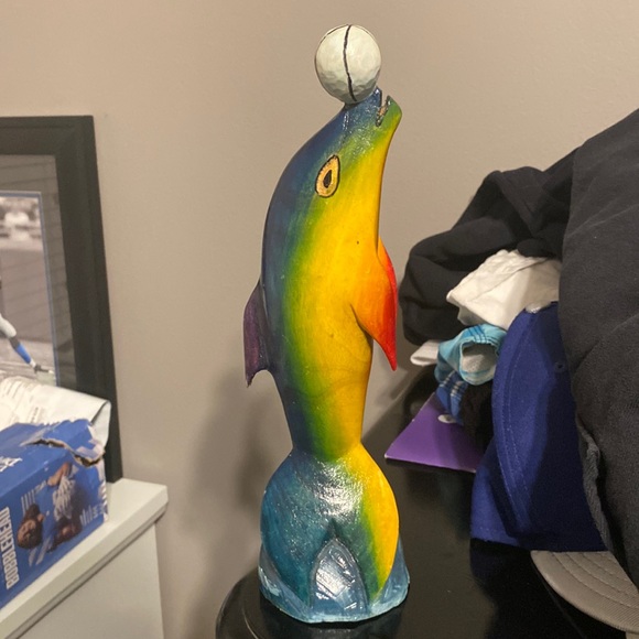 A wooden sculpture of a dolphin - Picture 1 of 1